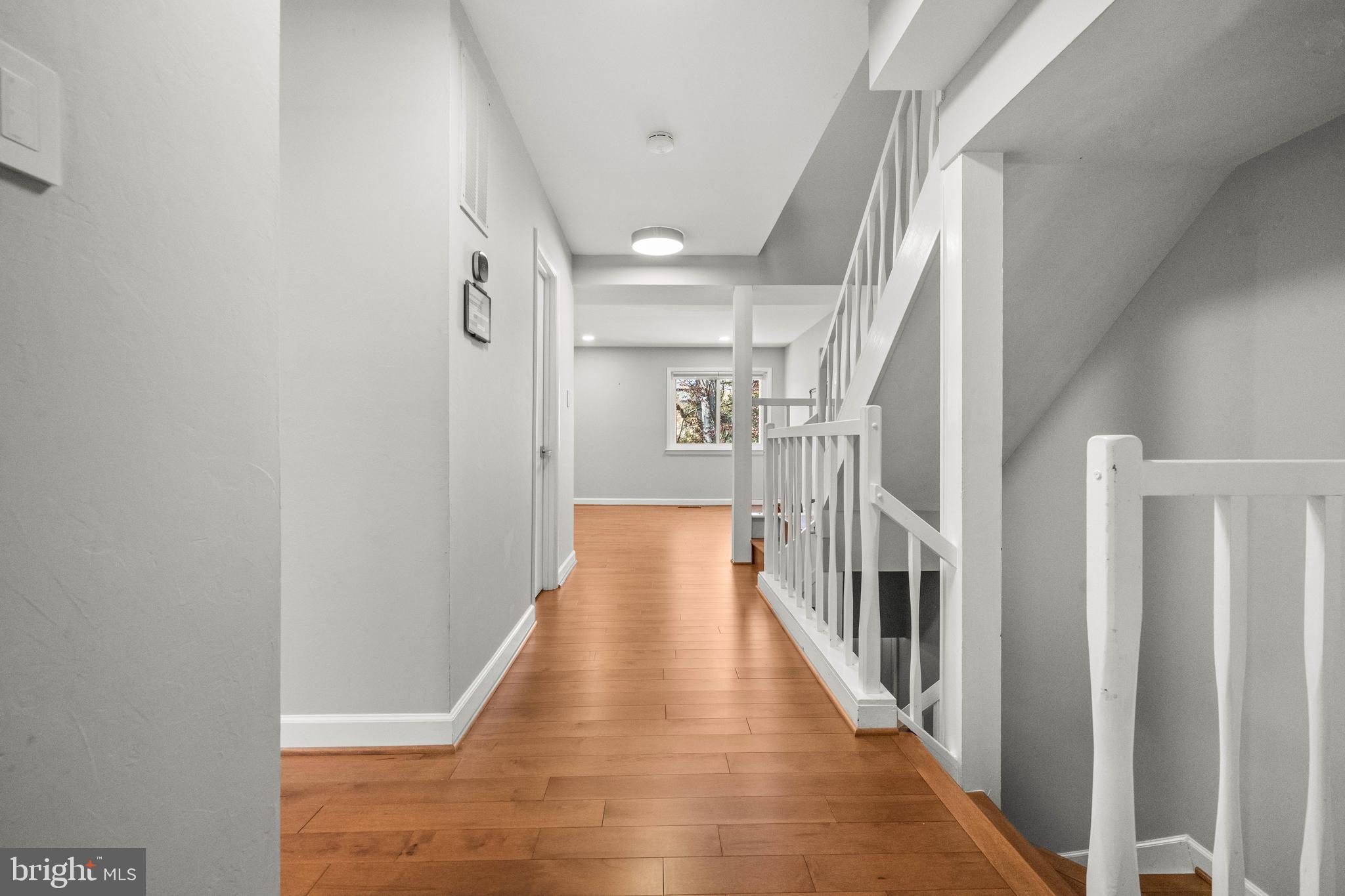 2152 Glencourse Lane Reston, VA 20191 - Photo 3 of 52 a view of a hallway with wooden floor and staircase