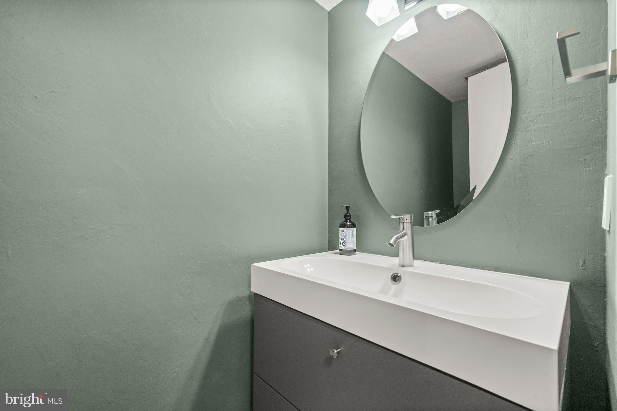 2152 Glencourse Lane Reston, VA 20191 - Photo 32 of 52 a bathroom with a sink and a mirror