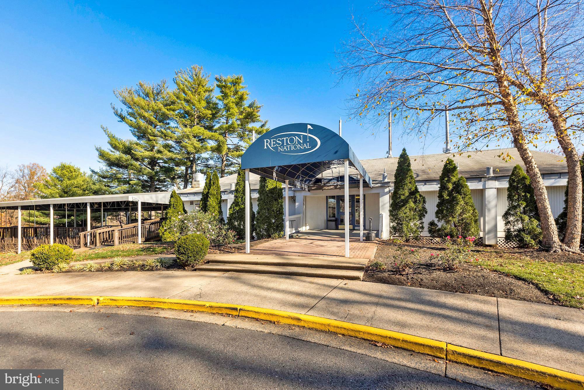 2152 Glencourse Lane Reston, VA 20191 - Photo 45 of 52 a view of a brick building next to a yard