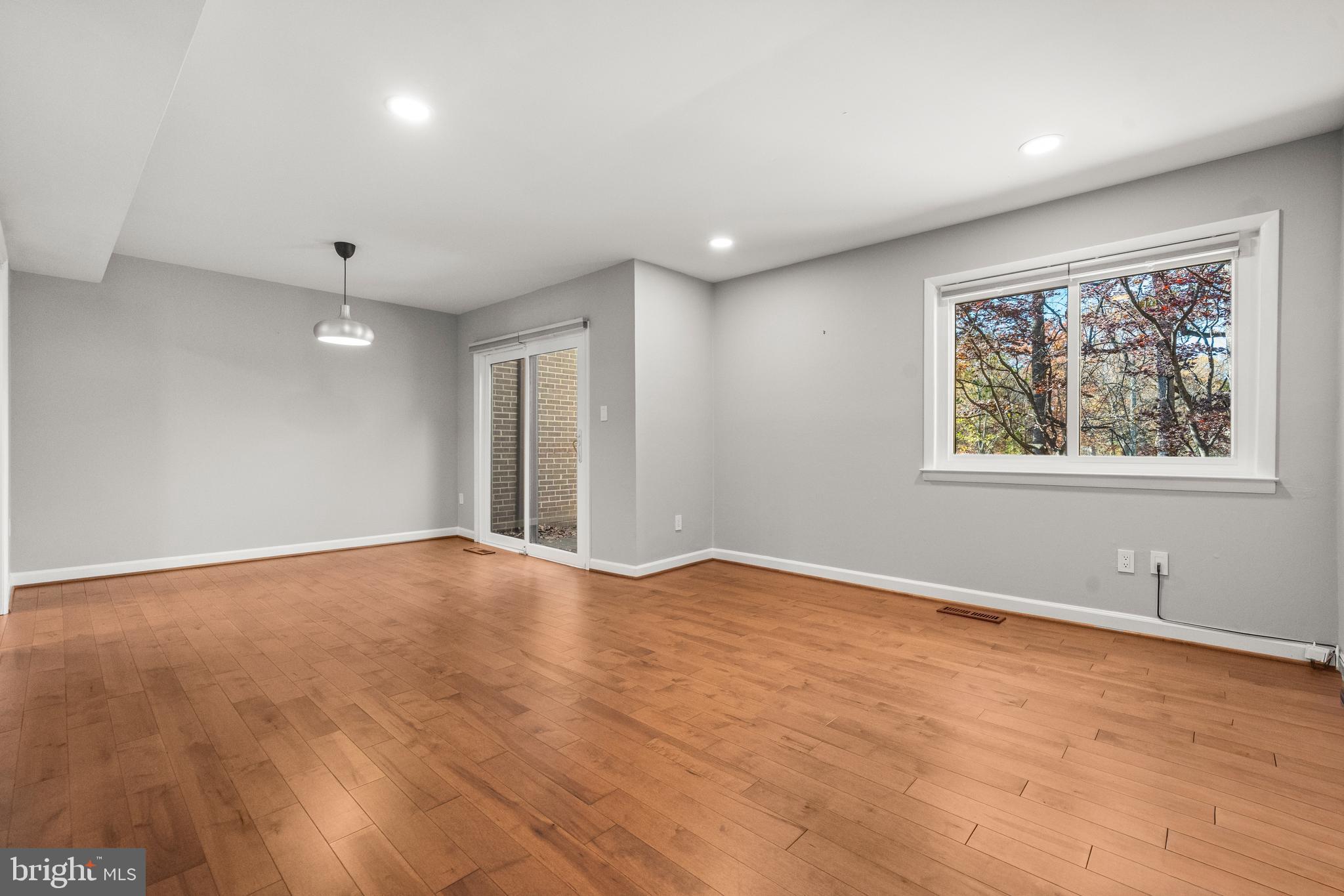 2152 Glencourse Lane Reston, VA 20191 - Photo 5 of 52 a view of an empty room with wooden floor and a window