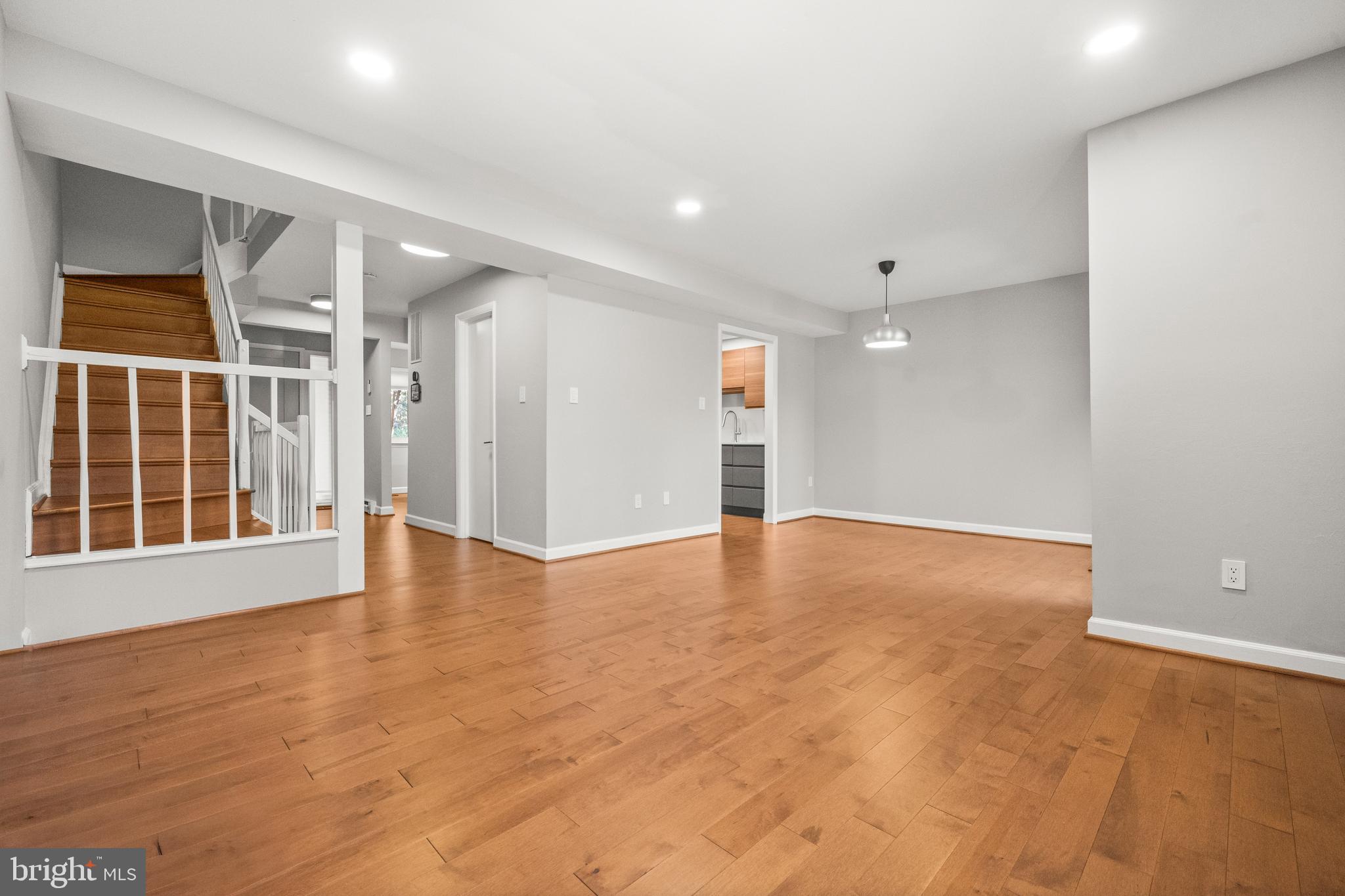 2152 Glencourse Lane Reston, VA 20191 - Photo 6 of 52 a view of an empty room with wooden floor and a window