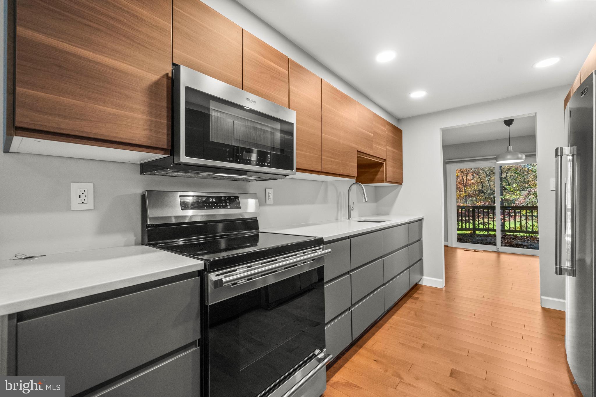 2152 Glencourse Lane Reston, VA 20191 - Photo 10 of 52 a kitchen with stainless steel appliances and cabinets