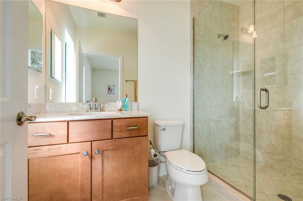 1308 Kendari Terrace Naples, FL 34113 - Photo 12 of 21 Full bath featuring vanity and a shower stall