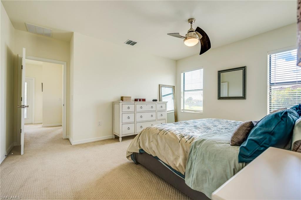 1308 Kendari Terrace Naples, FL 34113 - Photo 14 of 21 Bedroom with carpet floors and ceiling fan
