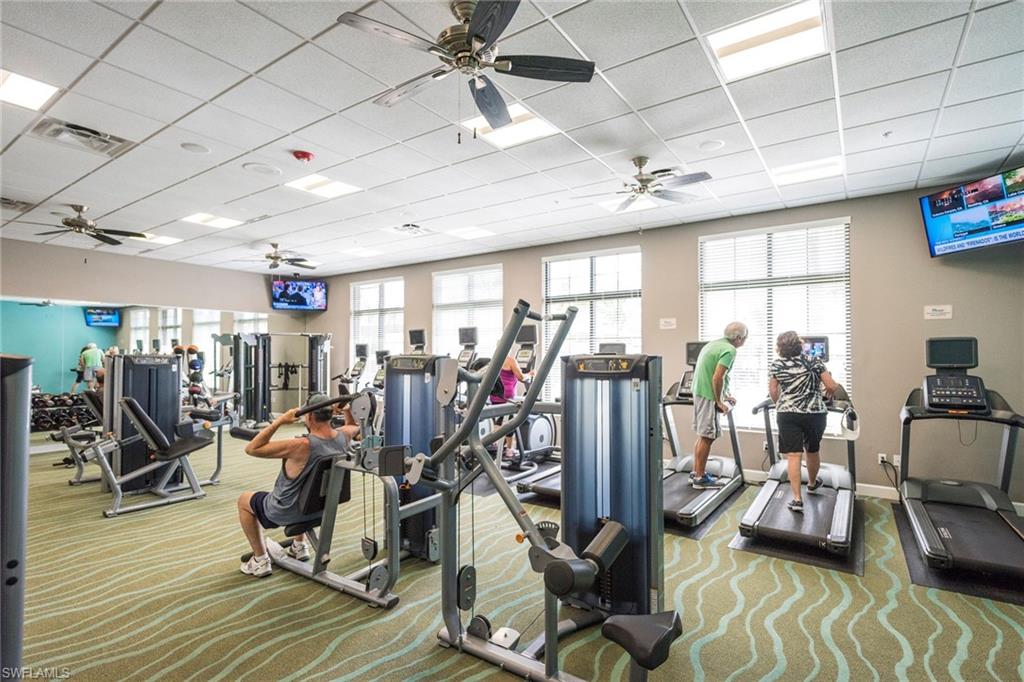 1308 Kendari Terrace Naples, FL 34113 - Photo 18 of 21 Exercise room featuring a ceiling fan and a drop ceiling