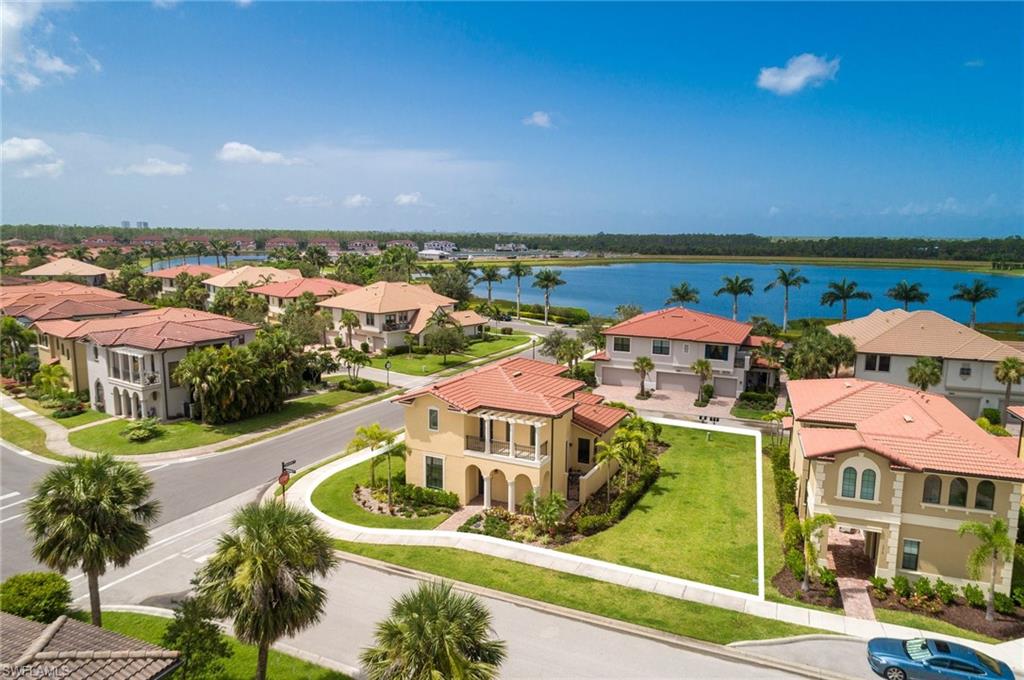 1308 Kendari Terrace Naples, FL 34113 - Photo 2 of 21 Aerial perspective of suburban area featuring a large body of water