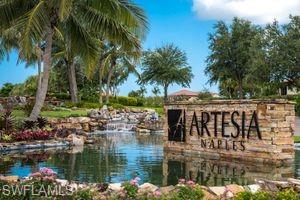 1308 Kendari Terrace Naples, FL 34113 - Photo 3 of 21 Community / neighborhood sign with a water view