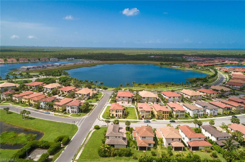 1308 Kendari Terrace Naples, FL 34113 - Photo 4 of 21 Aerial view of property and surrounding area featuring a nearby body of water and nearby suburban area