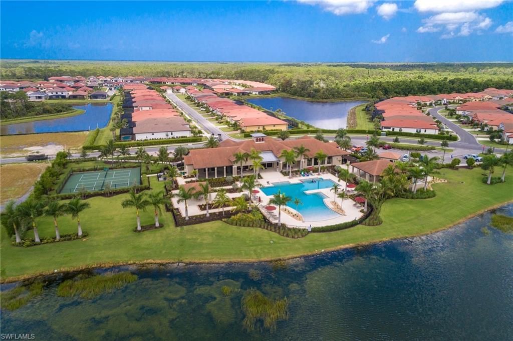 1308 Kendari Terrace Naples, FL 34113 - Photo 5 of 21 Aerial view of residential area with a nearby body of water and a pool