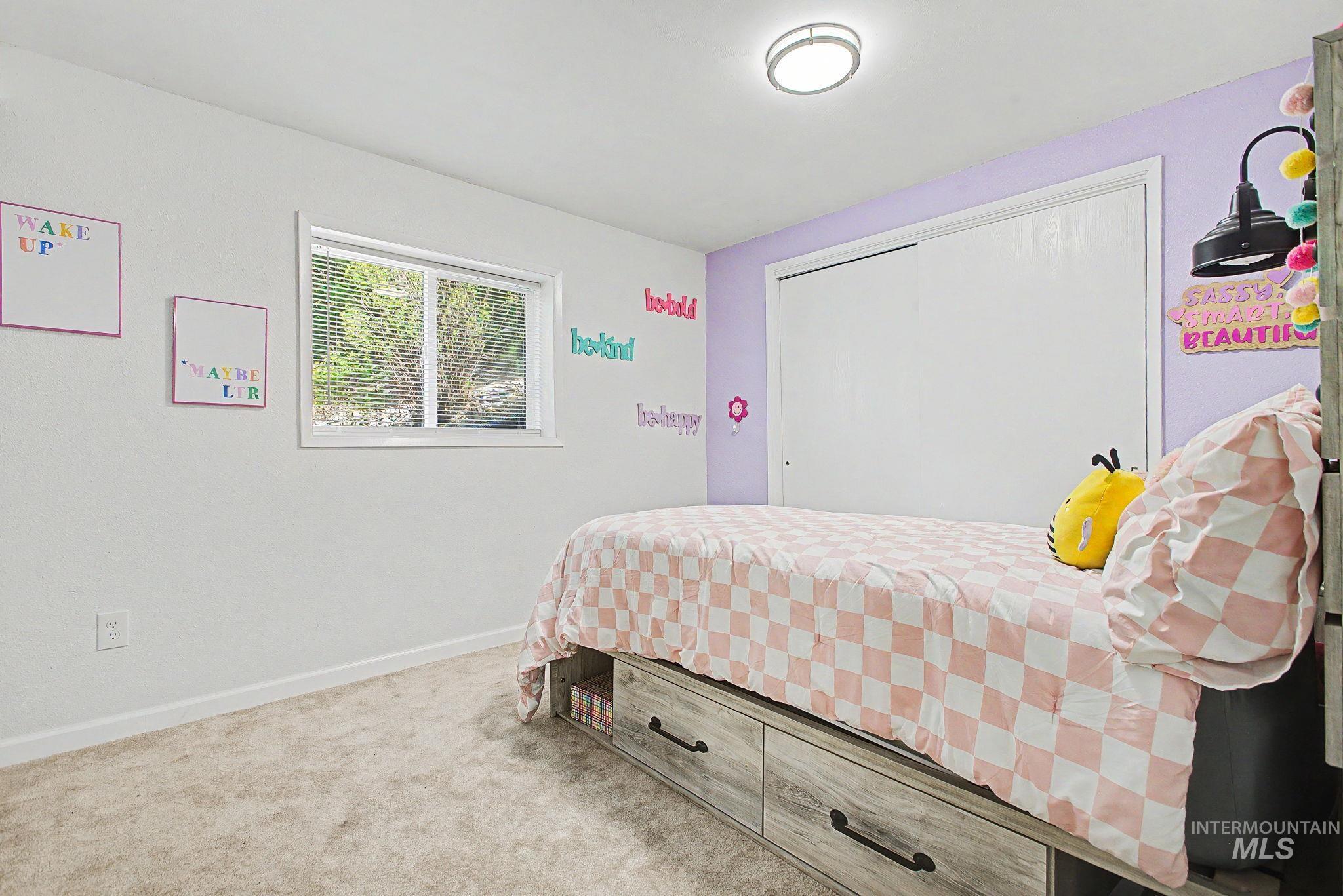 501 Karin Avenue Lewiston, ID 83501 - Photo 16 of 50 Bedroom with light carpet and baseboards