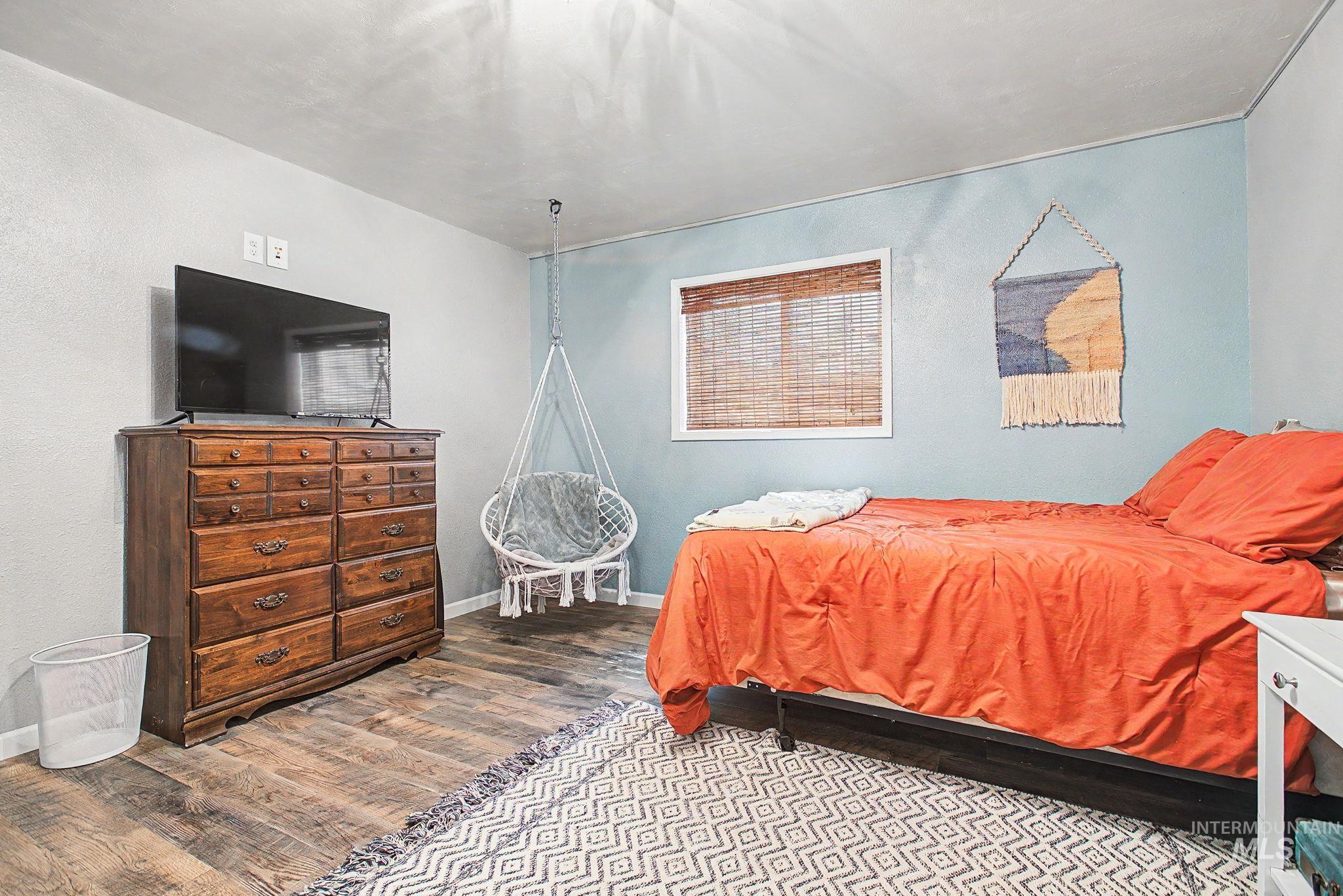 501 Karin Avenue Lewiston, ID 83501 - Photo 26 of 50 Bedroom with wood finished floors and baseboards