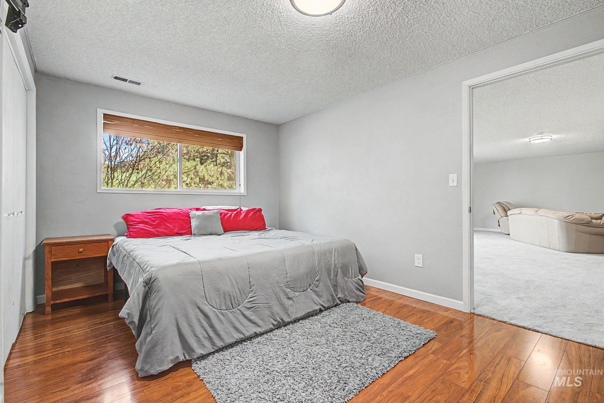 501 Karin Avenue Lewiston, ID 83501 - Photo 35 of 50 Bedroom with a textured ceiling and hardwood / wood-style flooring