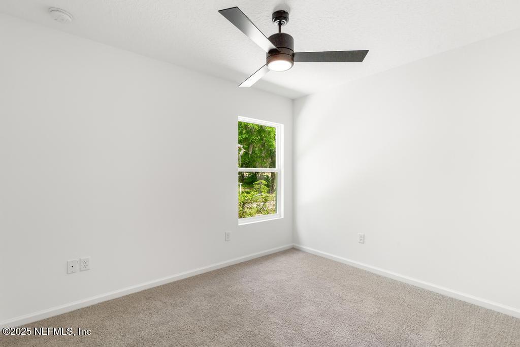 7845 Pipit Avenue Jacksonville, FL 32219 - Photo 18 of 38 an empty room with windows and fan