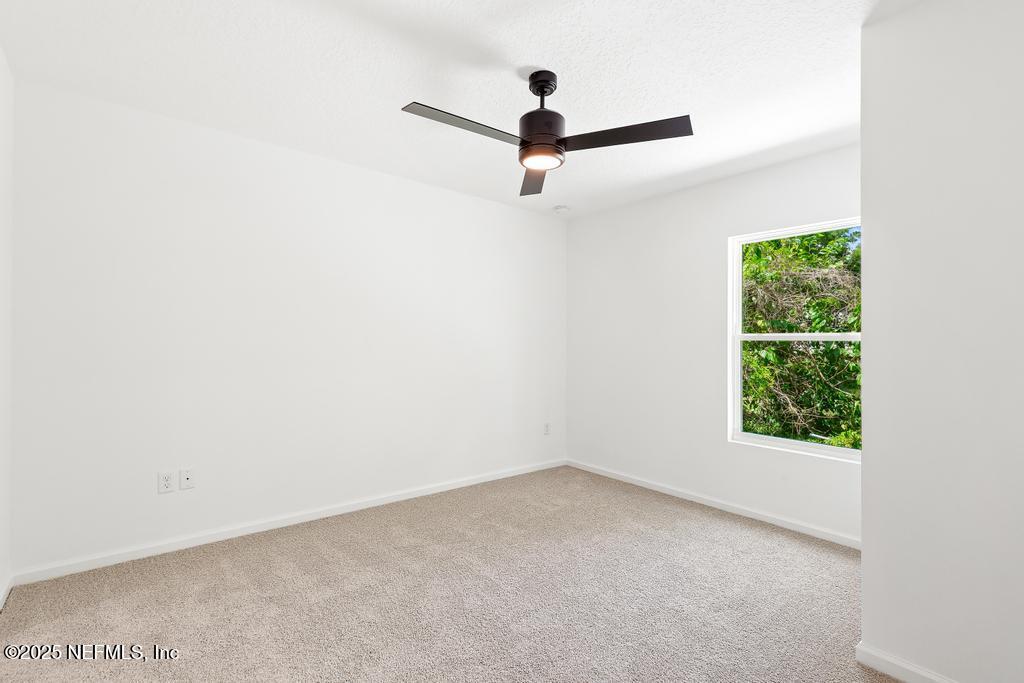 7845 Pipit Avenue Jacksonville, FL 32219 - Photo 23 of 38 a view of a room with window and ceiling fan