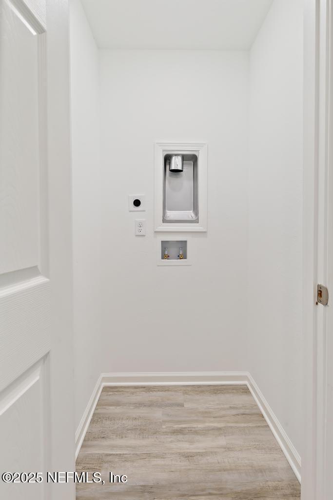 7845 Pipit Avenue Jacksonville, FL 32219 - Photo 32 of 38 a view of a small space with wooden floor and a window