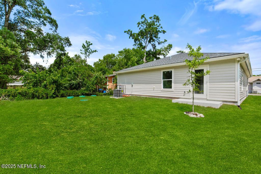 7845 Pipit Avenue Jacksonville, FL 32219 - Photo 37 of 38 a front view of a house with garden