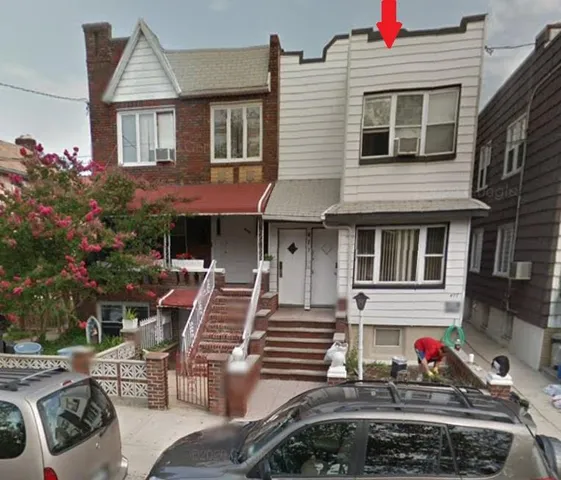 a front view of a house with lots of trees and flowers