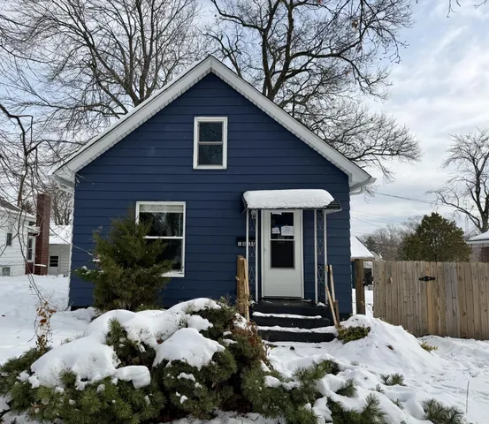 a view of a house covered in snow