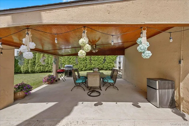 a view of a chairs and table in the patio