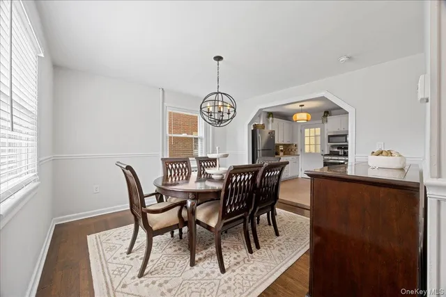 a view of a dining room with furniture and window