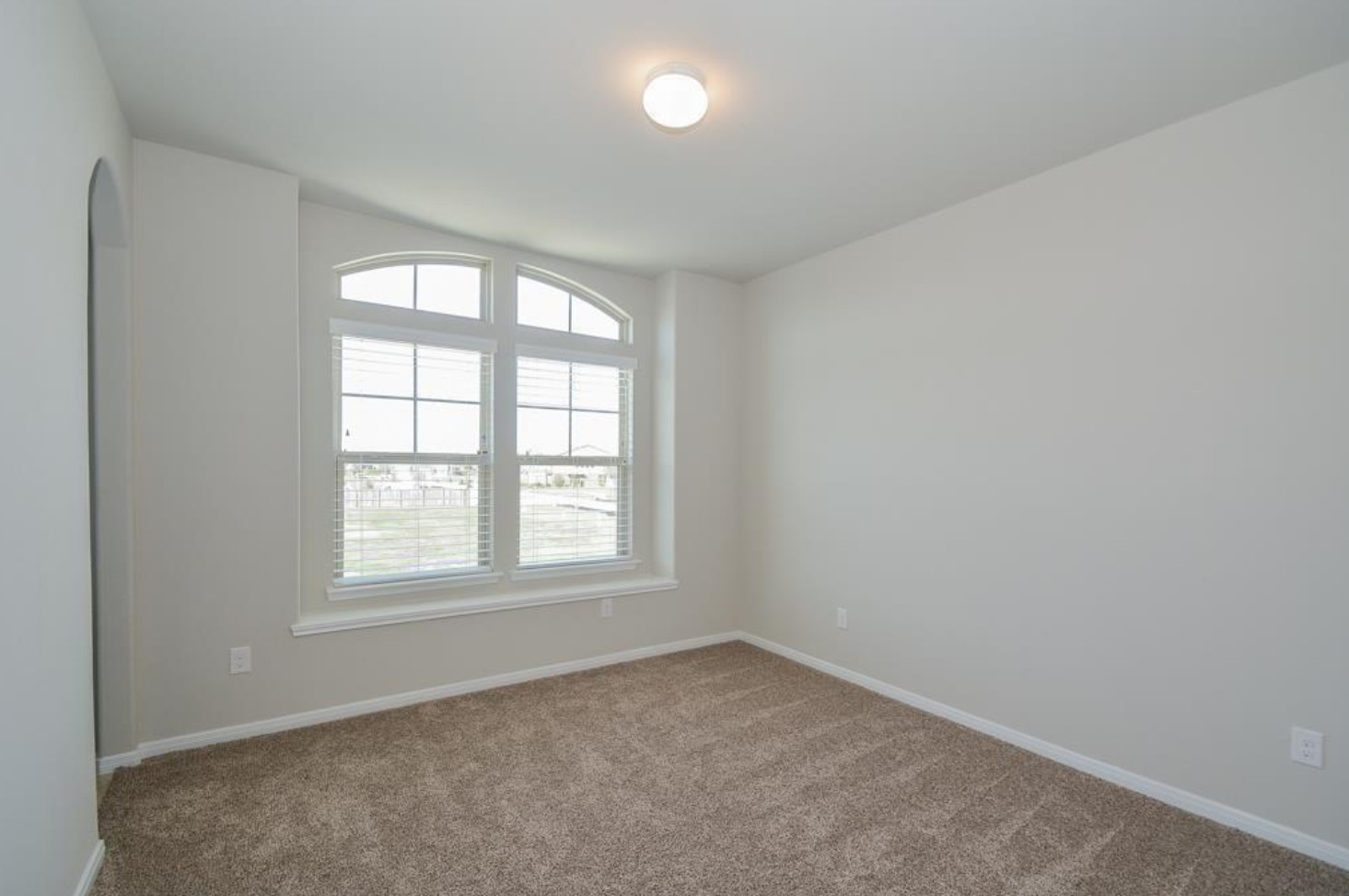 3306 Rainflower Springs Lane Rosenberg, TX 77471 - Photo 13 of 18 an empty room with a window