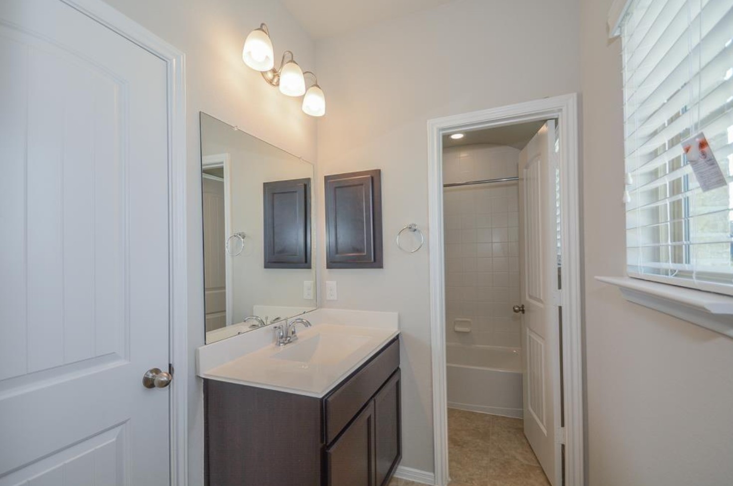 3306 Rainflower Springs Lane Rosenberg, TX 77471 - Photo 14 of 18 a bathroom with a sink a toilet and shower
