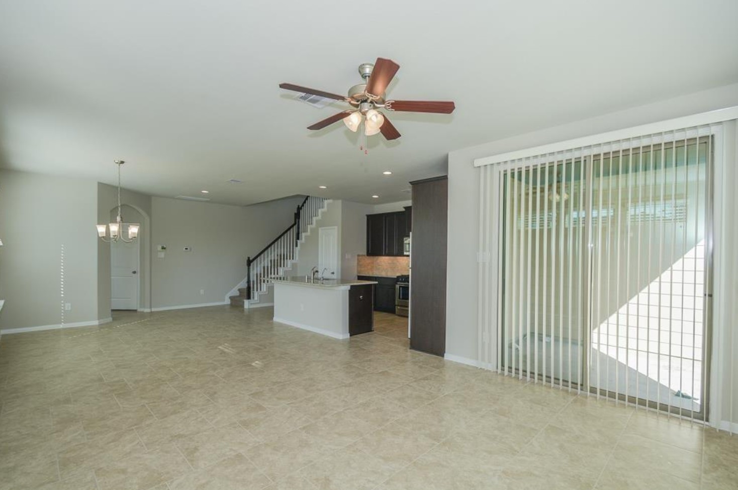 3306 Rainflower Springs Lane Rosenberg, TX 77471 - Photo 5 of 18 a view of a livingroom with a ceiling fan and window