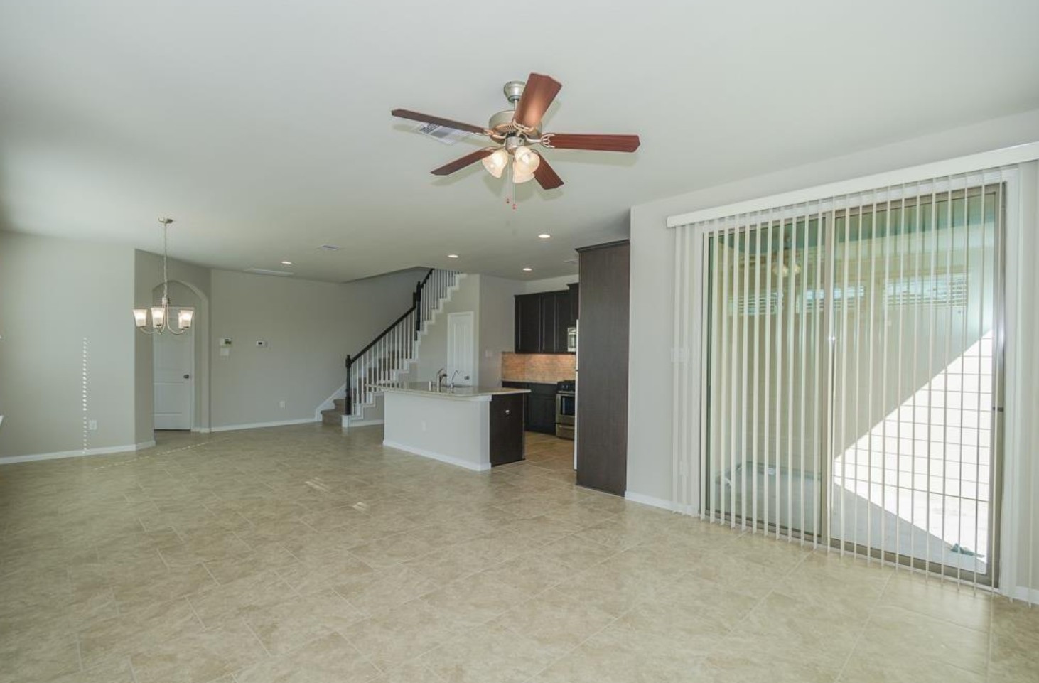 3306 Rainflower Springs Lane Rosenberg, TX 77471 - Photo 7 of 18 a view of a livingroom with a ceiling fan and window