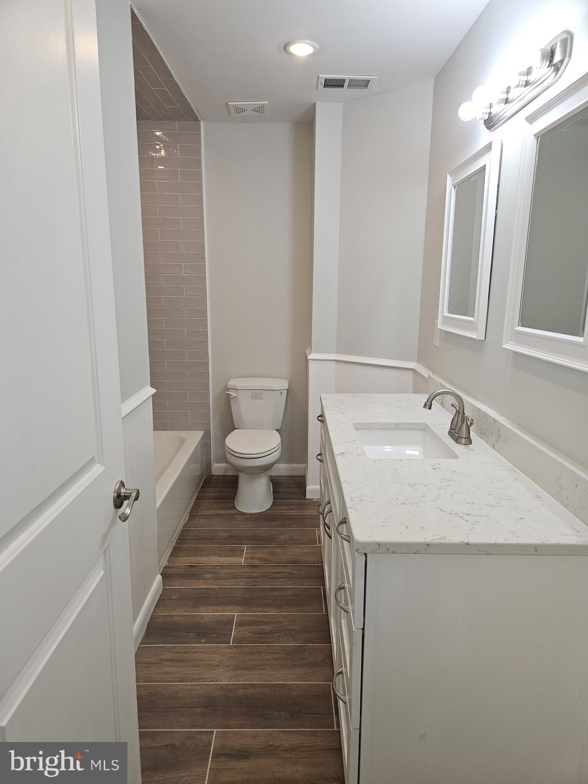 59 High Street, Unit A Philadelphia, PA 19144 - Photo 11 of 26 a bathroom with a sink and a mirror