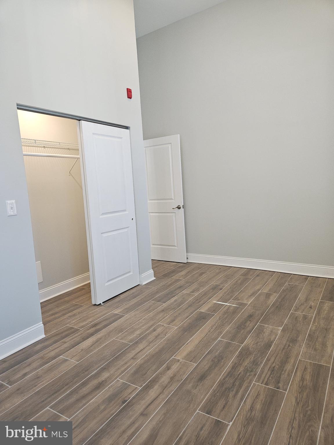 59 High Street, Unit A Philadelphia, PA 19144 - Photo 15 of 26 an empty room with wooden floor
