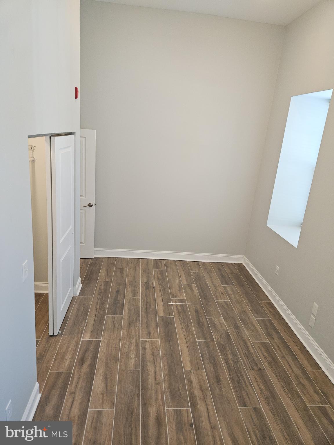 59 High Street, Unit A Philadelphia, PA 19144 - Photo 16 of 26 a view of a room with wooden floor and white walls