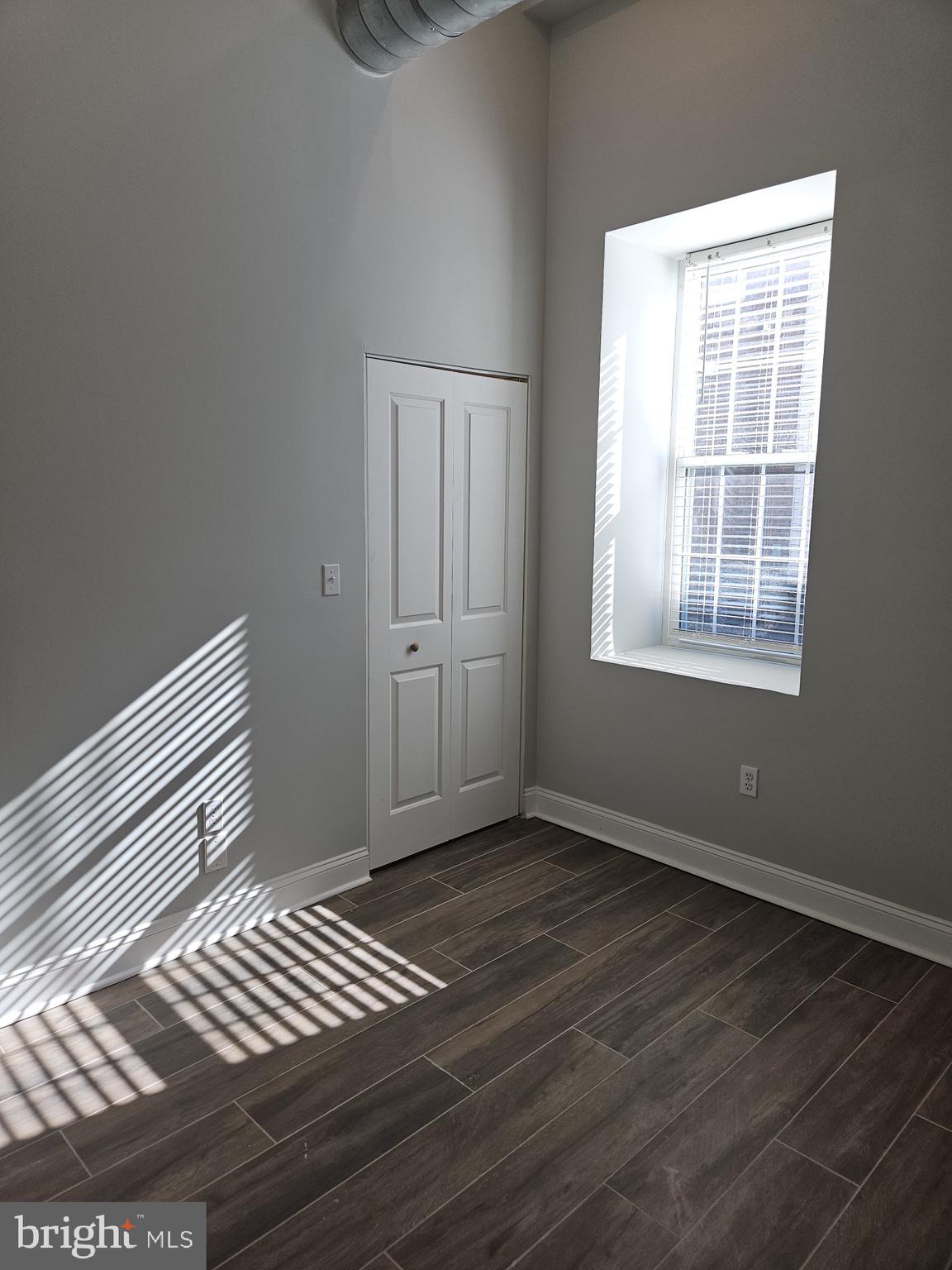 59 High Street, Unit A Philadelphia, PA 19144 - Photo 19 of 26 a view of wooden floor and windows in a room