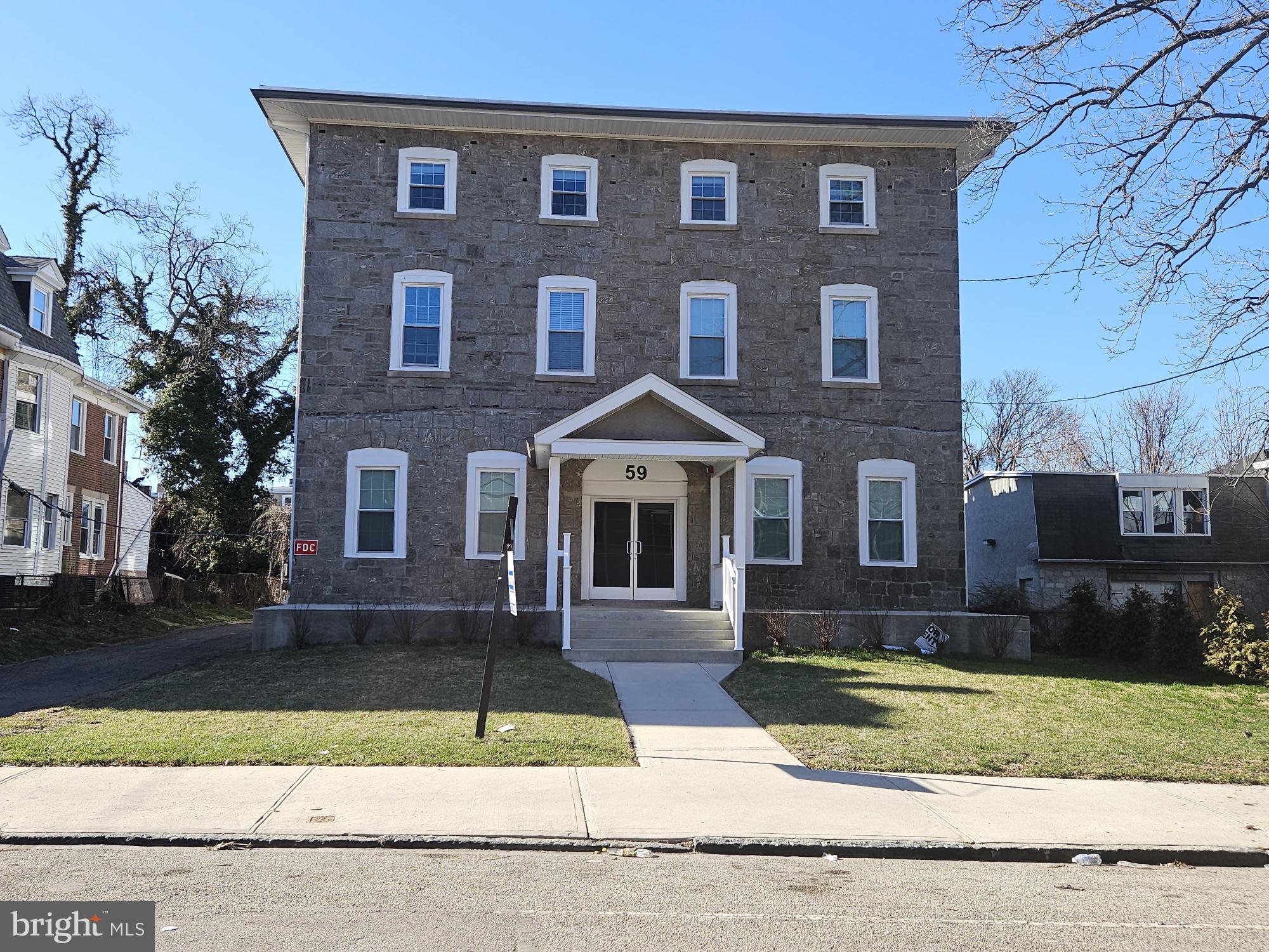 59 High Street, Unit A Philadelphia, PA 19144 - Photo 26 of 26 a front view of a house with a yard