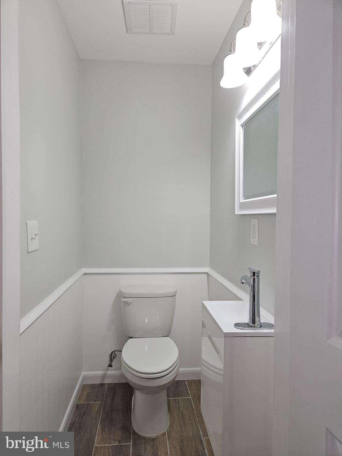 59 High Street, Unit A Philadelphia, PA 19144 - Photo 8 of 26 a white toilet sitting next to a bathroom sink