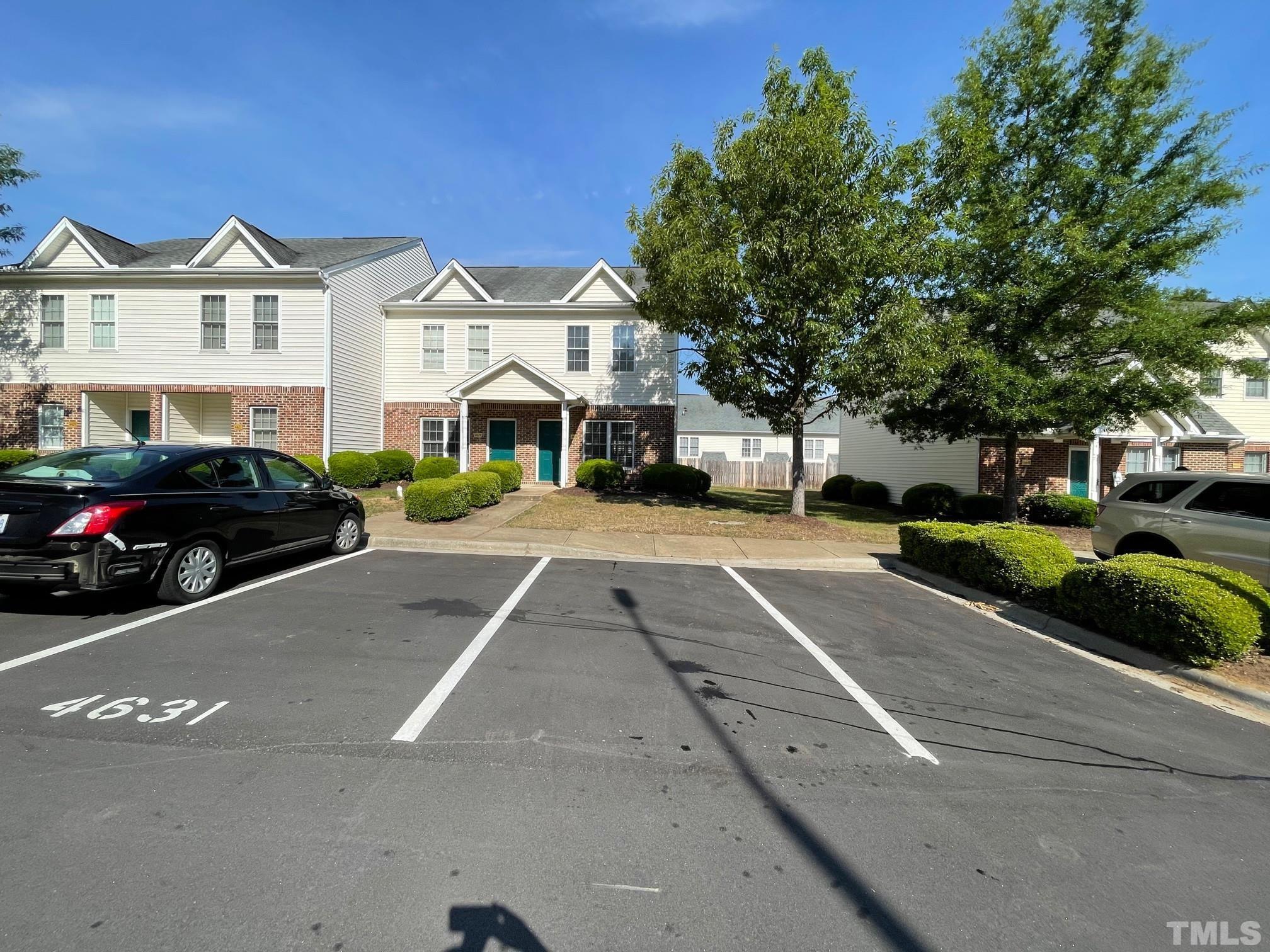 a view of multiple houses with a street