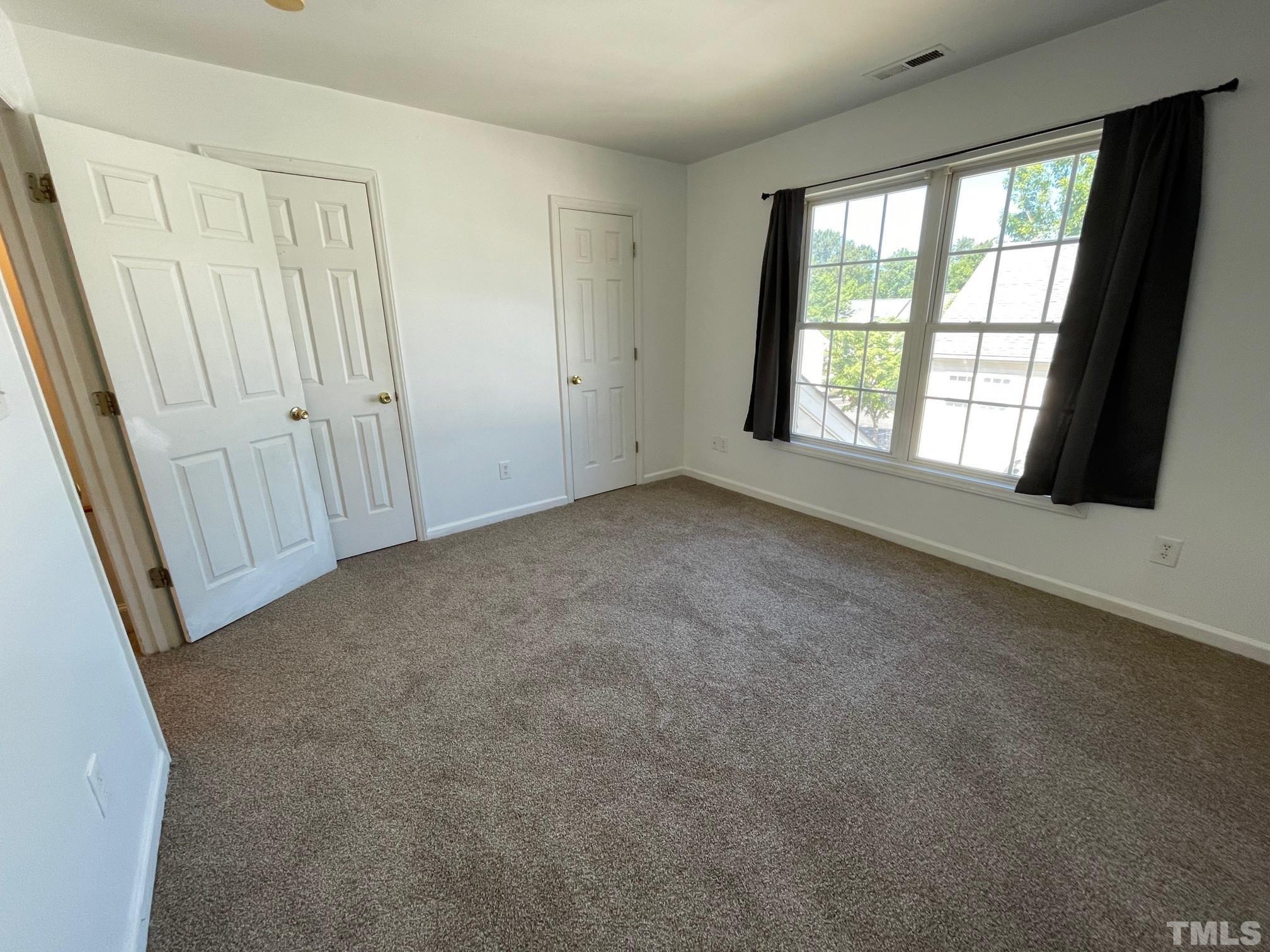 4631 Ravi Road Raleigh, NC 27604 - Photo 11 of 18 an empty room with windows