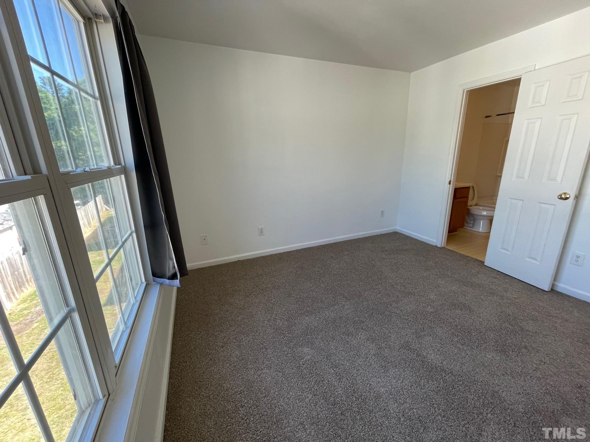 4631 Ravi Road Raleigh, NC 27604 - Photo 12 of 18 an empty room with windows