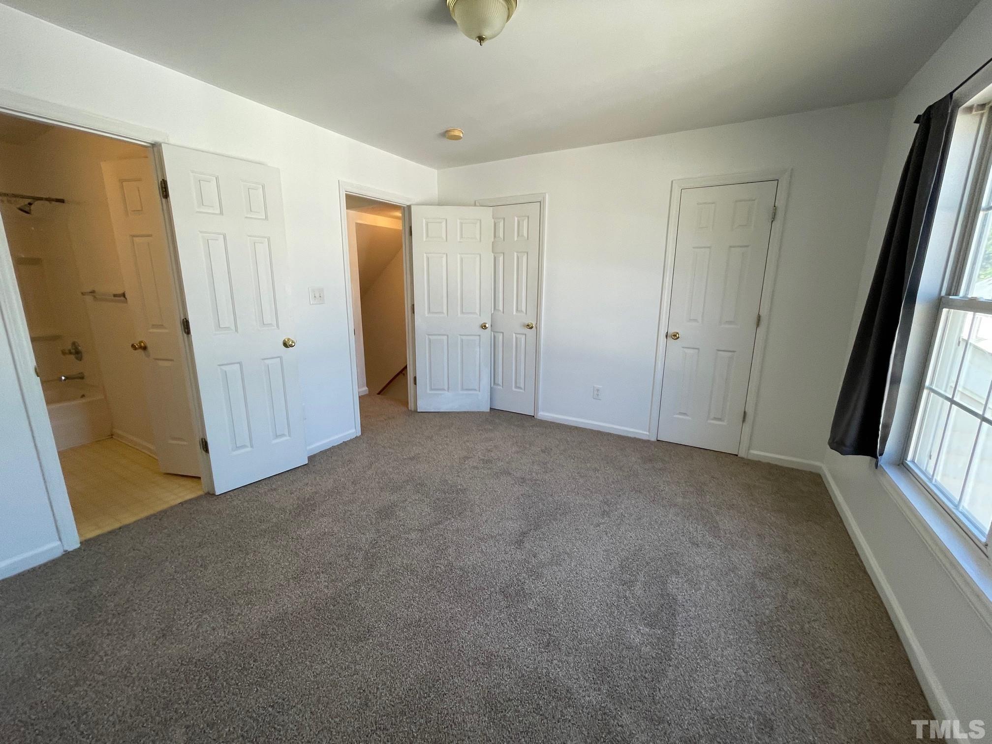 4631 Ravi Road Raleigh, NC 27604 - Photo 13 of 18 a view of an empty room with windows