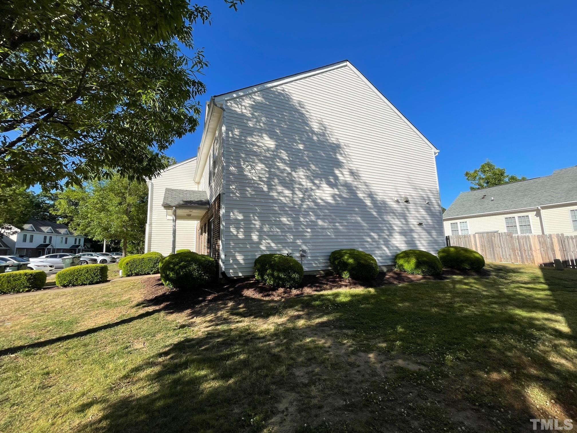 4631 Ravi Road Raleigh, NC 27604 - Photo 3 of 18 a view of a house with a yard
