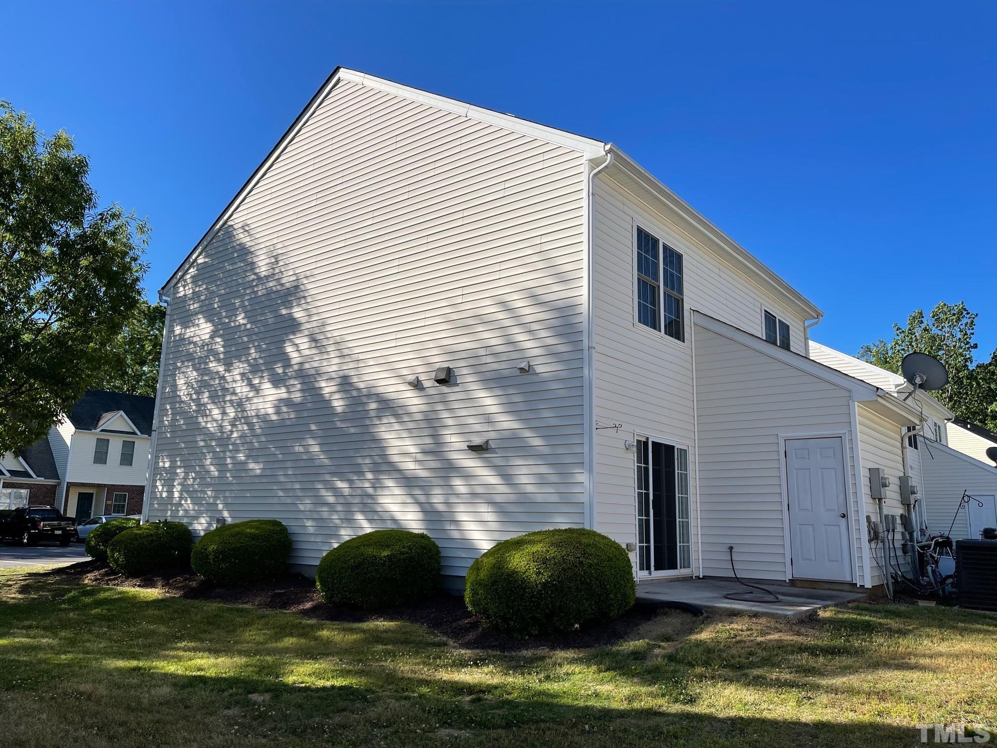 4631 Ravi Road Raleigh, NC 27604 - Photo 4 of 18 a front view of a house with a garden