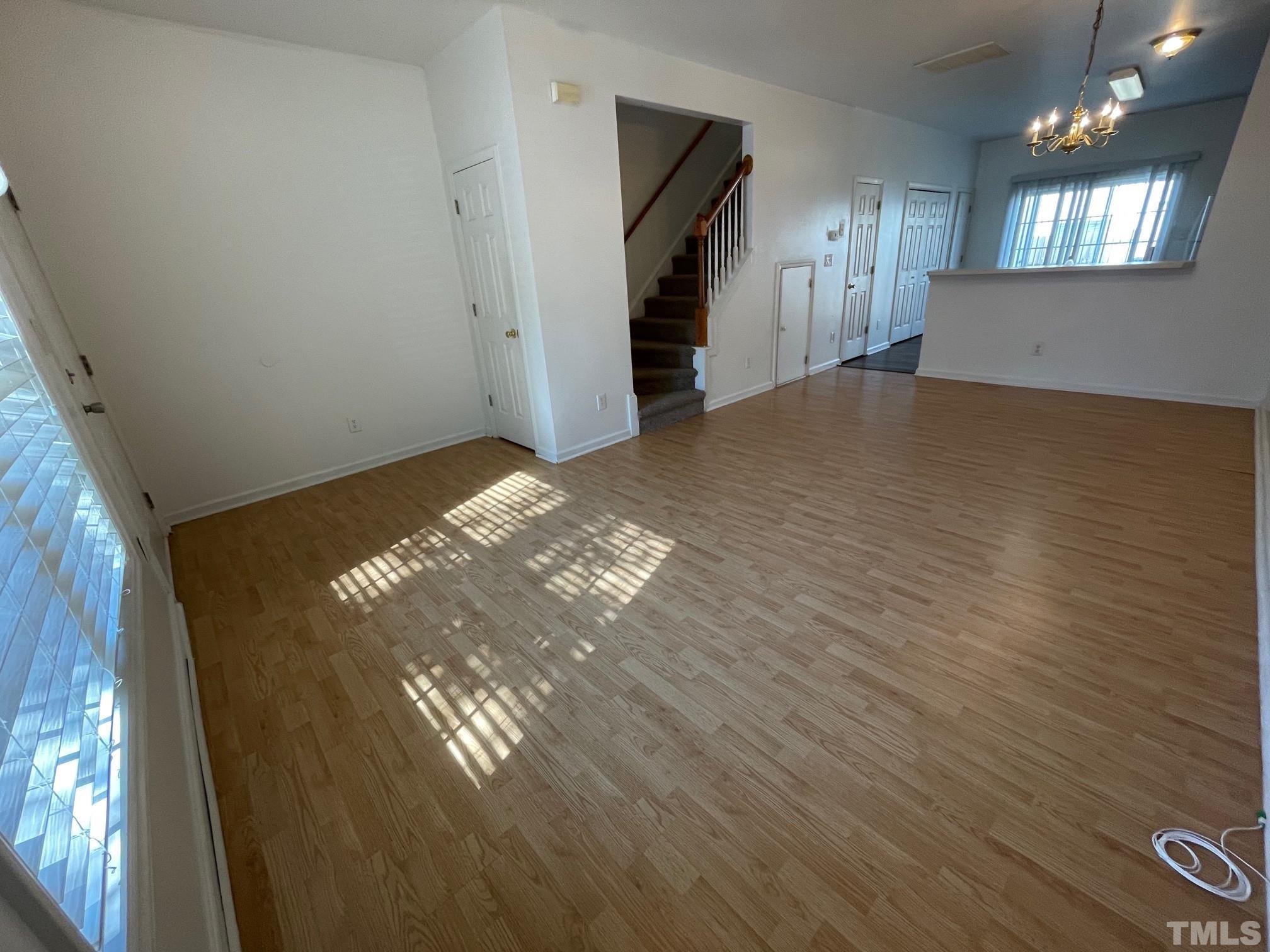 4631 Ravi Road Raleigh, NC 27604 - Photo 6 of 18 a view of empty room with wooden floor