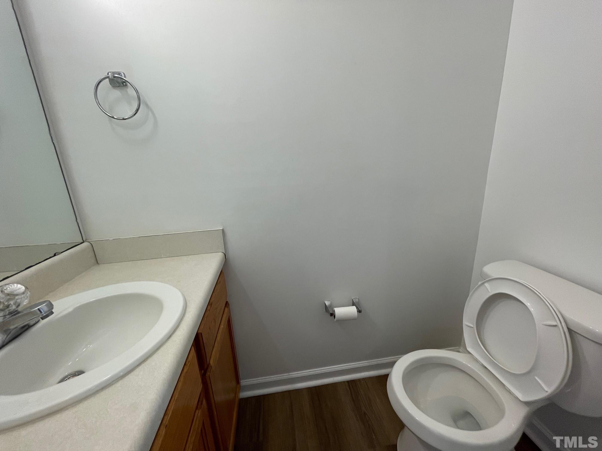 4631 Ravi Road Raleigh, NC 27604 - Photo 8 of 18 a bathroom with a sink and a toilet