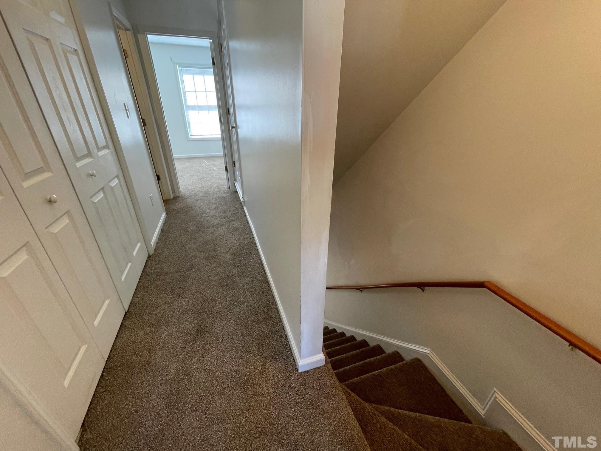 4631 Ravi Road Raleigh, NC 27604 - Photo 10 of 18 a view of a hallway with wooden floor
