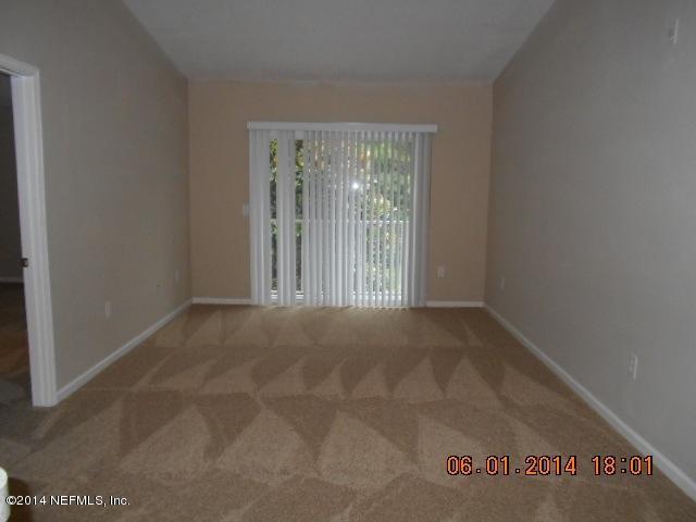 7920 Merrill Road, Unit 614 Jacksonville, FL 32277 - Photo 2 of 5 a view of an empty room with a window