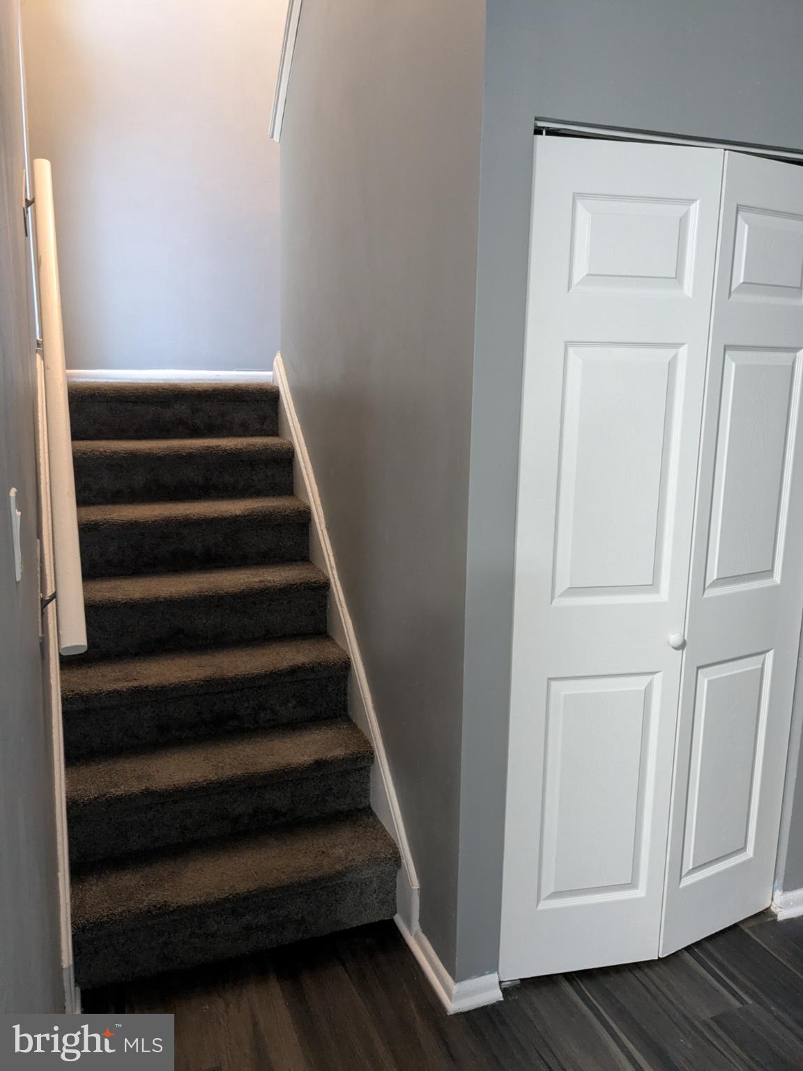 51 Noble Road Sicklerville, NJ 08081 - Photo 13 of 27 a view of staircase with wooden floor and white walls