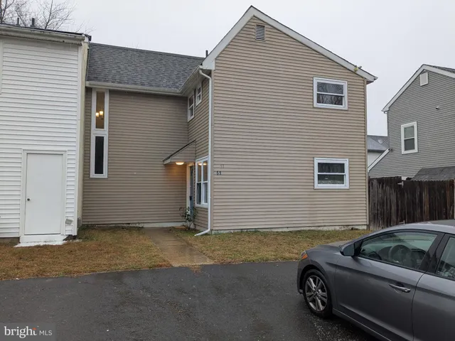 a car parked in front of a house