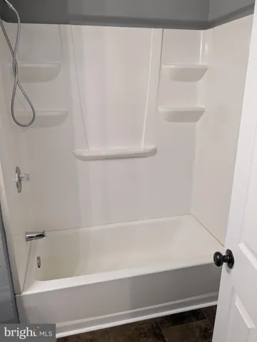 a bathroom with a bathtub