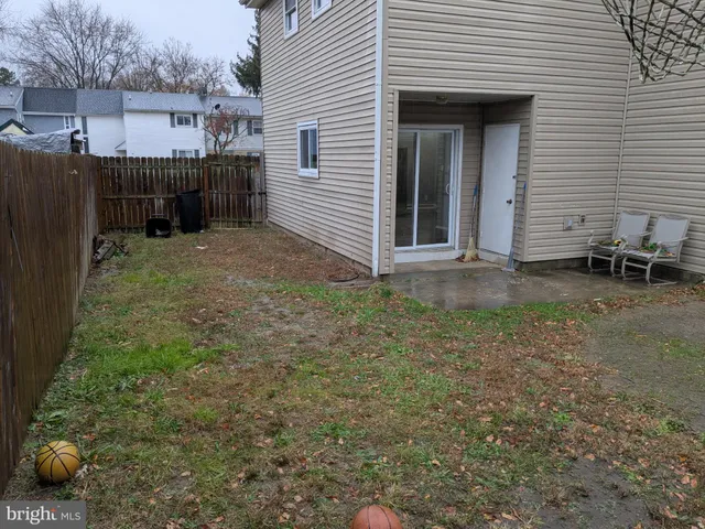 a view of a backyard with a sitting area