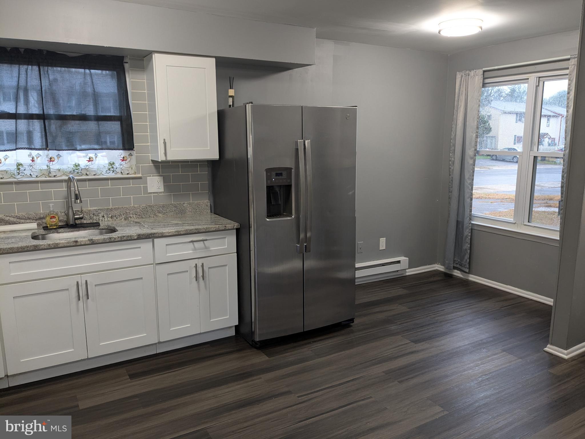 51 Noble Road Sicklerville, NJ 08081 - Photo 6 of 27 a kitchen with a refrigerator sink and cabinets