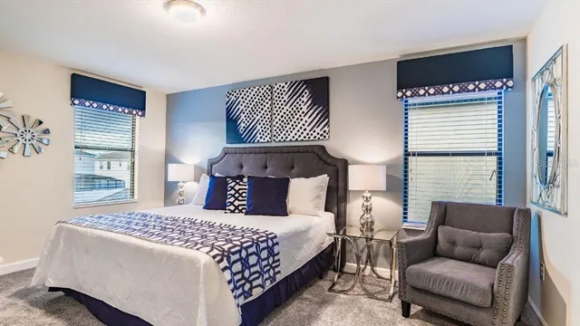 a bedroom with a bed and a couch